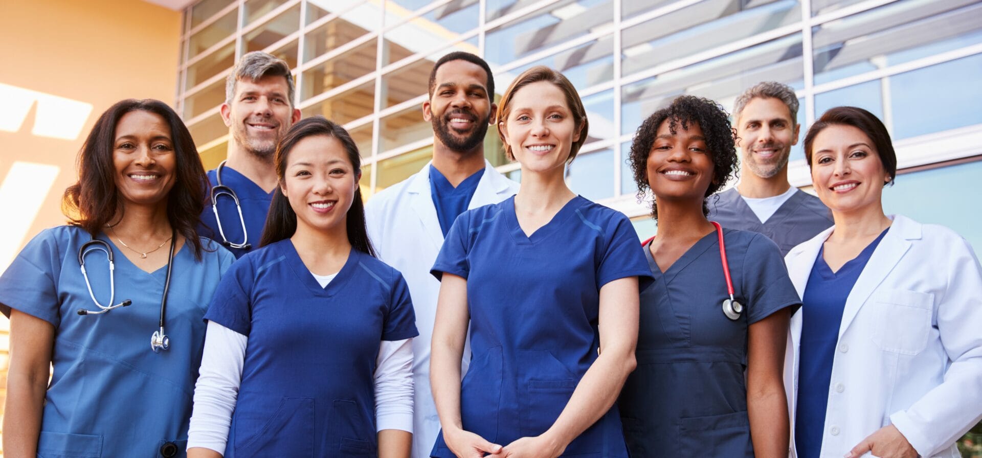 Medical team standing outside hospital
