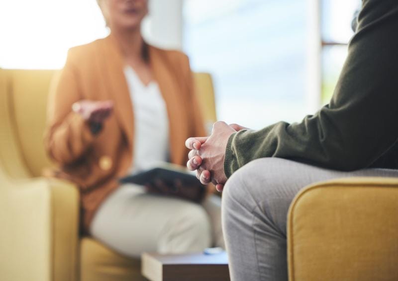 a man and woman sitting in chairs