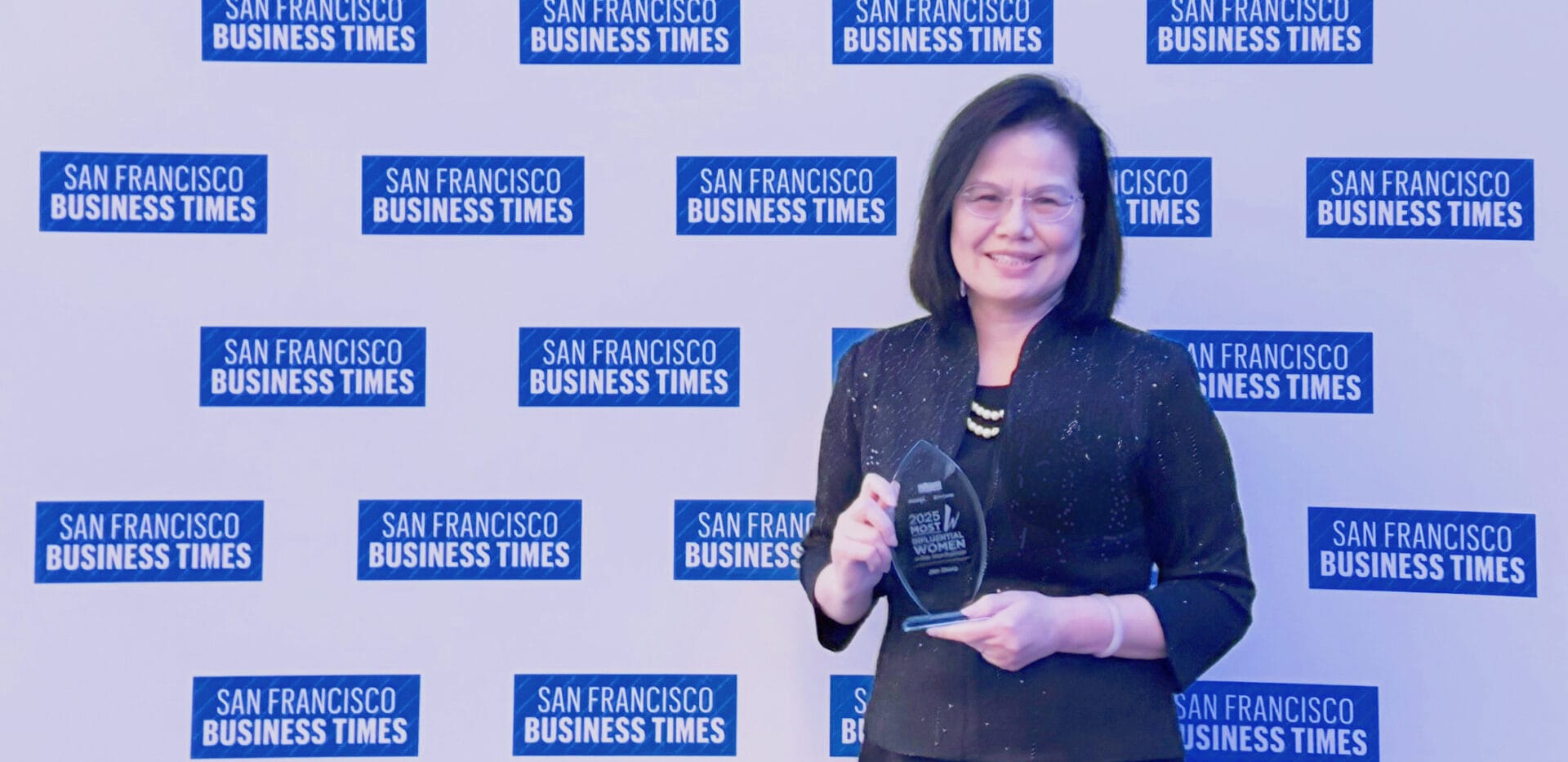 Chinese Hospital CEO holding a SFBT trophy