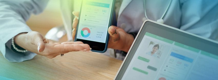 a doctor holding a phone and showing data