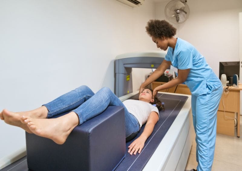 Patient undergoing a DEXA scan.